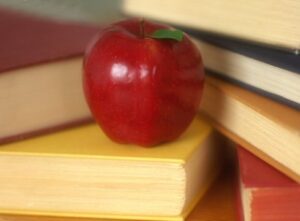 photo of apple with books